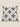 Front product view of a white Basotho-inspired geometric cushion with black and grey patterned motifs.