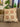 Decorative pillow with circular pattern on a couch in a living room setting