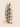 Standing side profile of a Xhosa-inspired geometric cushion with mustard yellow, grey, and white triangular motifs and visible seam detail.
