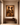 Large framed Afro-modern artwork The Union Sankofa III displayed above a wooden console table in a minimalist warm-toned interior.