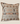 Front view of a square Sepedi-inspired cushion with cream, rust, dark brown and white geometric stripe patterns.