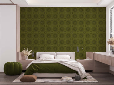 A bedroom with complete bedroom furniture and bedding. On the one wall is a wallpaper with a Olive green background and dark green circles.