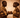 The Offering by NIZARRA, Afro-modern African wall art featuring two figures exchanging a ceremonial vessel in warm earthy tones