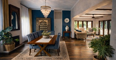 Contemporary African interior design open plan dining and living space with timber table and chandelier in Johannesburg residence