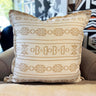 Decorative pillow with geometric pattern on a couch