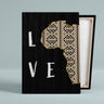Canvas print background is black with letters in white spelling L O V E, the O is made up of a map of Africa cut in half. stretched on canvas frame