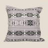 Front product view of a grey Bapedi-inspired geometric cushion with black and white pattern on a warm stone background.