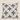 Front product view of a white Basotho-inspired geometric cushion with black and grey patterned motifs.