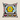 NIZARRA Ndebele scatter cushion with a bold black and white geometric pattern, yellow central motif, blue, pink and orange accents, shown on a warm neutral background.