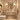 Modern guest powder room featuring NIZARRA Crossline 02 Stone geometric wallpaper behind a floating vanity, with a brass-framed mirror, warm lighting and neutral stone finishes.