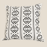 Front product view of a NIZARRA ivory cushion with bold black mud cloth-inspired geometric stripes.