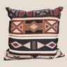 Top view of NIZARRA Sepedi-inspired geometric cushion showing the concealed black zip and patterned fabric detail.