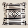 Front view of a square NIZARRA Venda-inspired cushion featuring a cream, taupe, grey and black geometric diamond pattern.