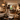 NIZARRA Interior designer assessing lamps, light temperatures and layered lighting within an open-plan living and dining space.