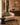 Modern interior design with a beige sofa, decorative pillow, and 'Nizarra' branding.
