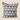 Grey and white geometric triangle Xhosa inspired NIZARRA cushion on a warm neutral background, shown from the front for a clean product catalogue image.