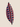 Side profile of a red, black and white Swazi-inspired cushion showing the zipper seam, plump shape and bold geometric pattern.