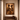 Large framed Afro-modern artwork The Union Sankofa III displayed above a wooden console table in a minimalist warm-toned interior.