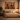Afro-modern bedroom interior featuring Sankofa collection wall art prints above a neutral bed, styled with warm earthy tones and soft ambient lighting.