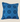 Front view of a square sky-blue NIZARRA cushion featuring dark blue circular and dotted Setswana-inspired motifs.