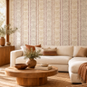 NIZARRA Strata wallpaper creates a patterned feature wall in a modern living room with a cream sectional sofa, round wooden coffee table and natural woven textures.