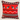 Front view of a red, black and white Swazi-inspired cushion with shield motifs, stripe detailing and a bold white zigzag pattern on a neutral background.
