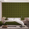 A bedroom with complete bedroom furniture and bedding. On the one wall is a wallpaper with a Olive green background and dark green circles.