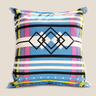 Front product view of a NIZARRA Venda-inspired cushion with bold blue, pink, yellow, black and white geometric motifs.