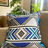 Decorative pillow with geometric pattern on a couch
