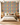 Modern bedroom with NIZARRA Zulu-inspired geometric wallpaper featuring colourful diamond motifs, earthy triangles and black-and-ivory detailing behind a neutral upholstered bed.