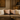 Beige sofa with decorative pillows in a living room setting. Motso designed
